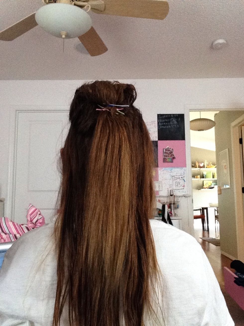 Randomly place bobby pins in the back. You can use as many as you will need.