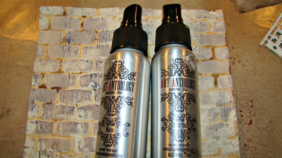 Randomly spritz your brick background with different tones of sprays, I used Art Anthology Warm and French Toast.