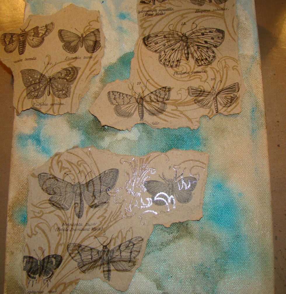 Randomly tear pieces and decided where you want them on your canvas.