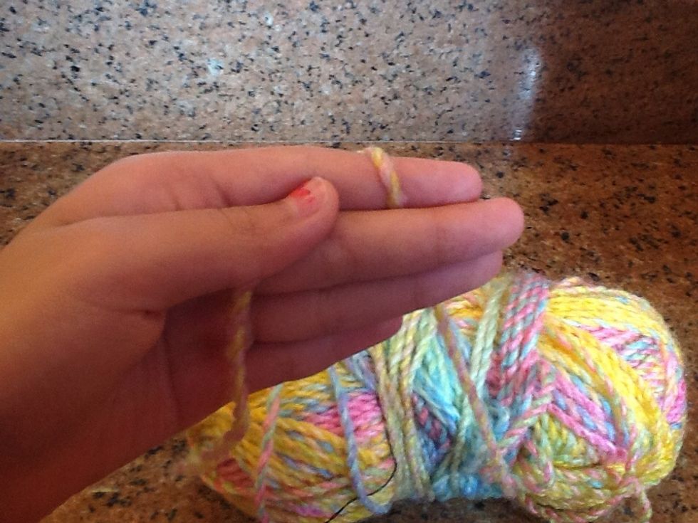 Rap the yarn around your ring finger once....