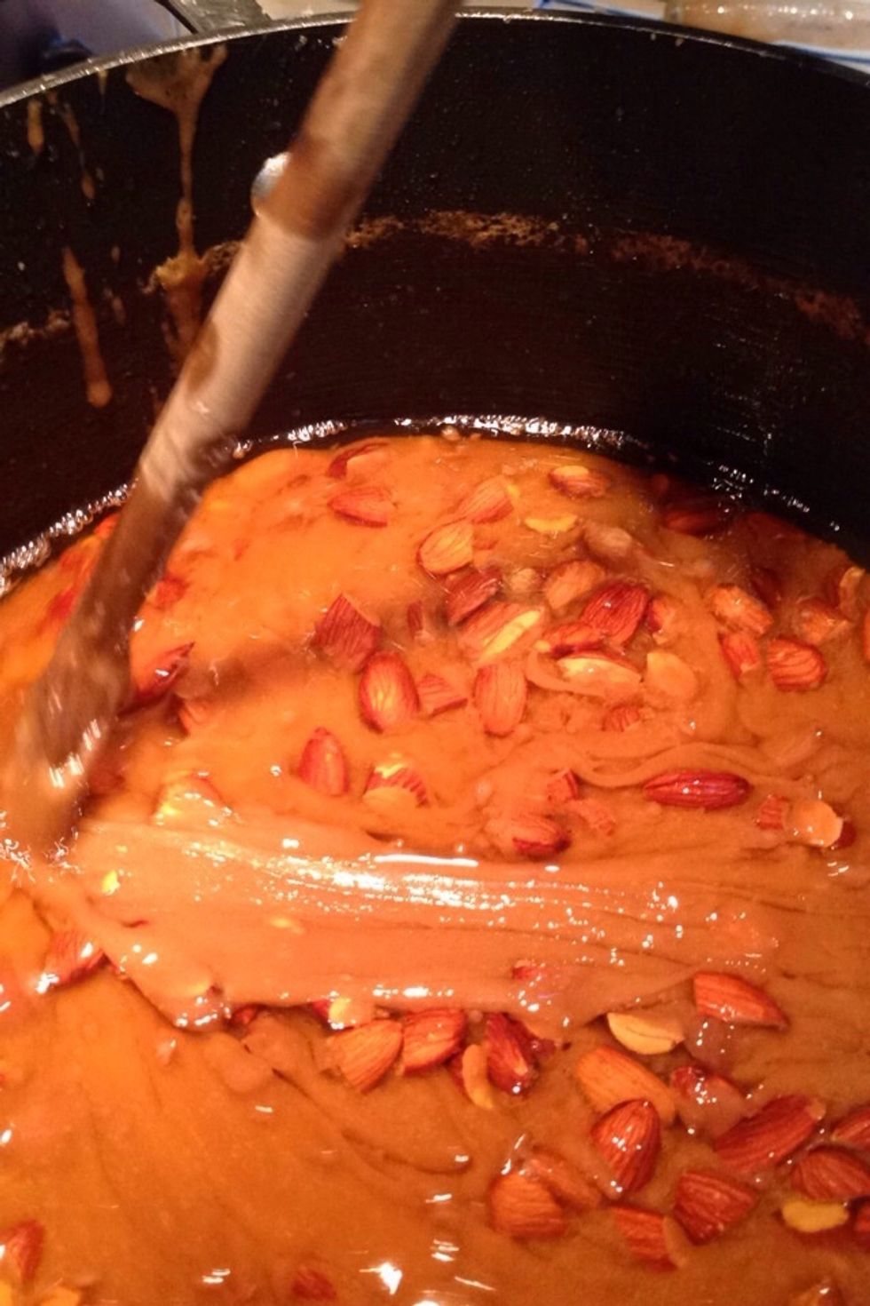 Raw almonds being stirred in