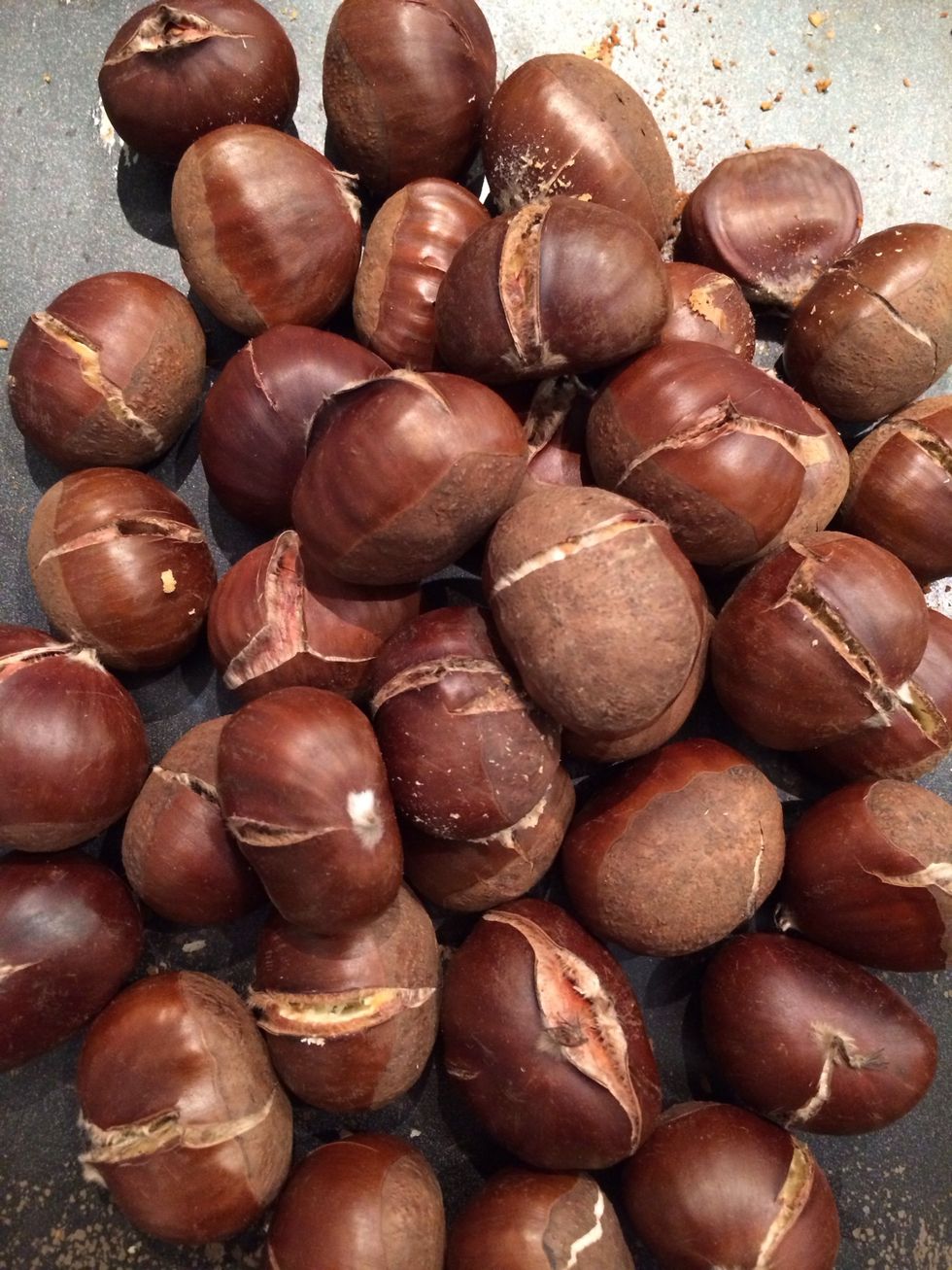Raw chestnuts Grilled in the oven. Make a slit in each chestnut. Put them in a preheated oven 180C FOR 30-35 mins. Peel