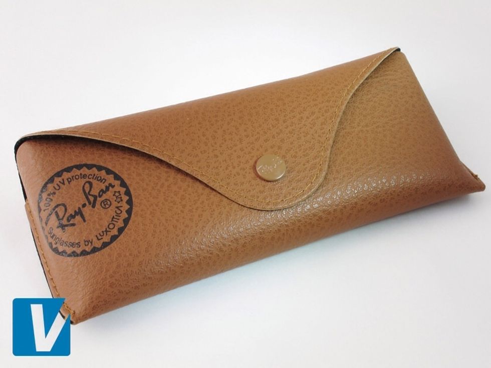 Ray-Ban Aviator sunglasses are packaged in a brown case with the logo written in black font. Note the registered trademark R's & the two stars. Also check that the popper is engraved.