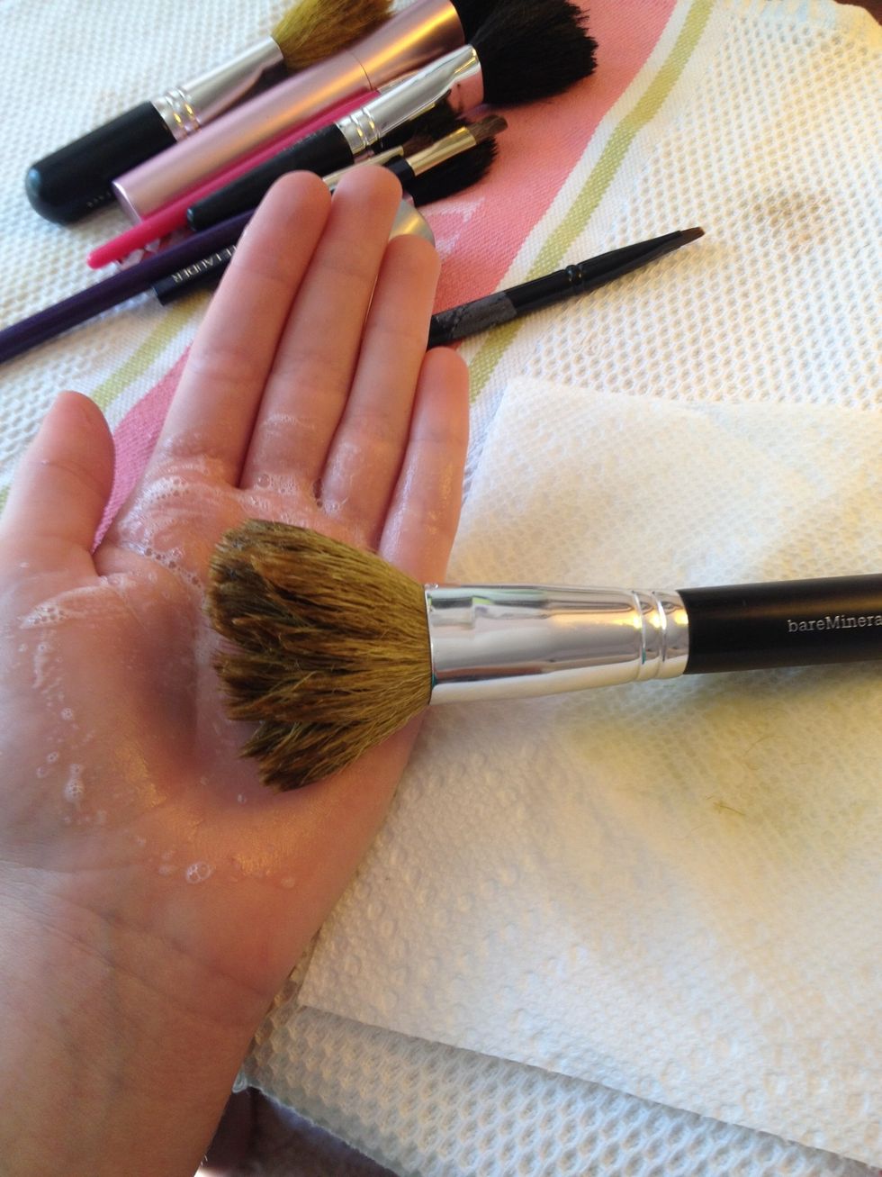 Re-wet the brush and pour a small amount of soap into the palm of your hand (the quantity depends on the size of the brush) lather the brush for about 30 seconds.