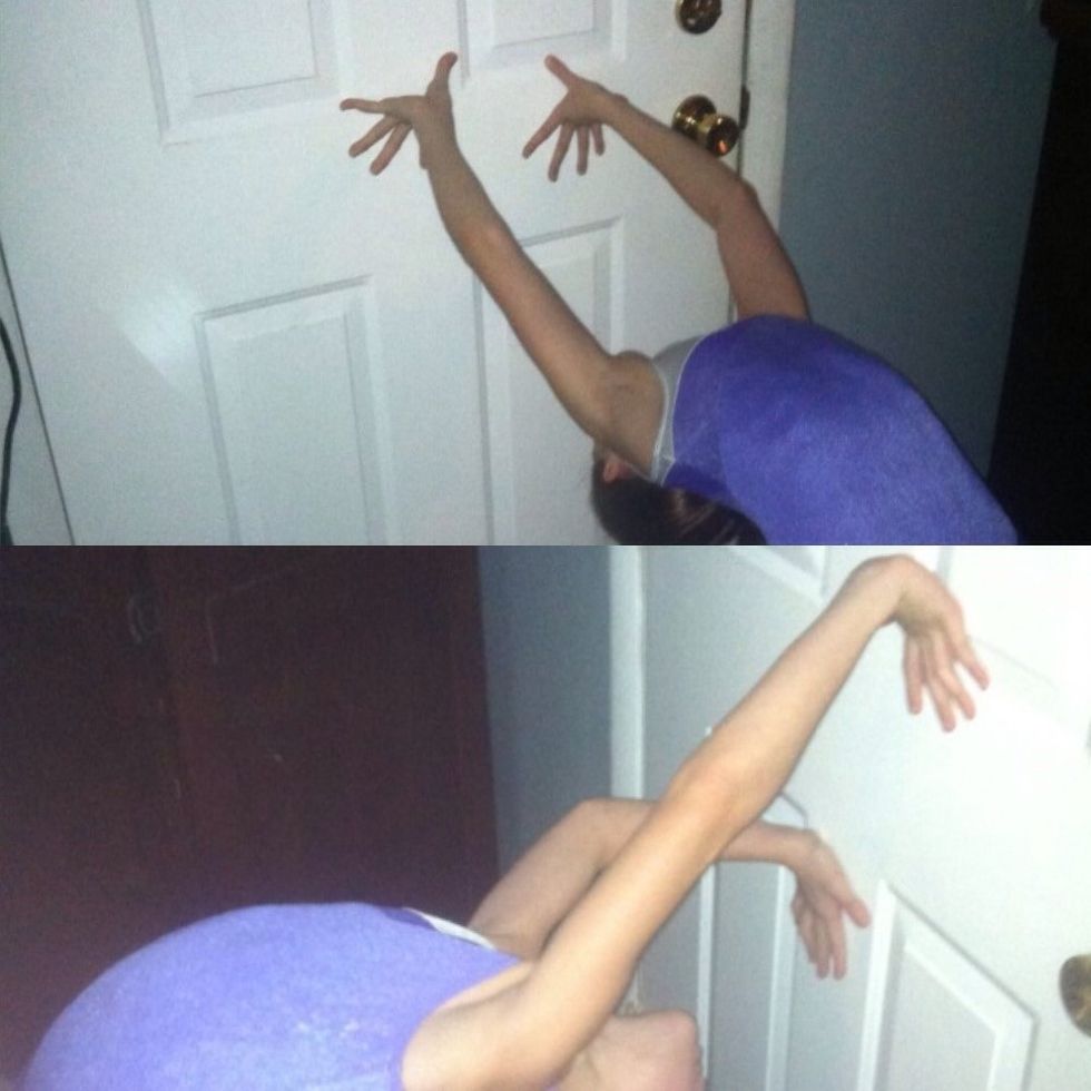 Reach back and start walking down the wall. Go slowly!