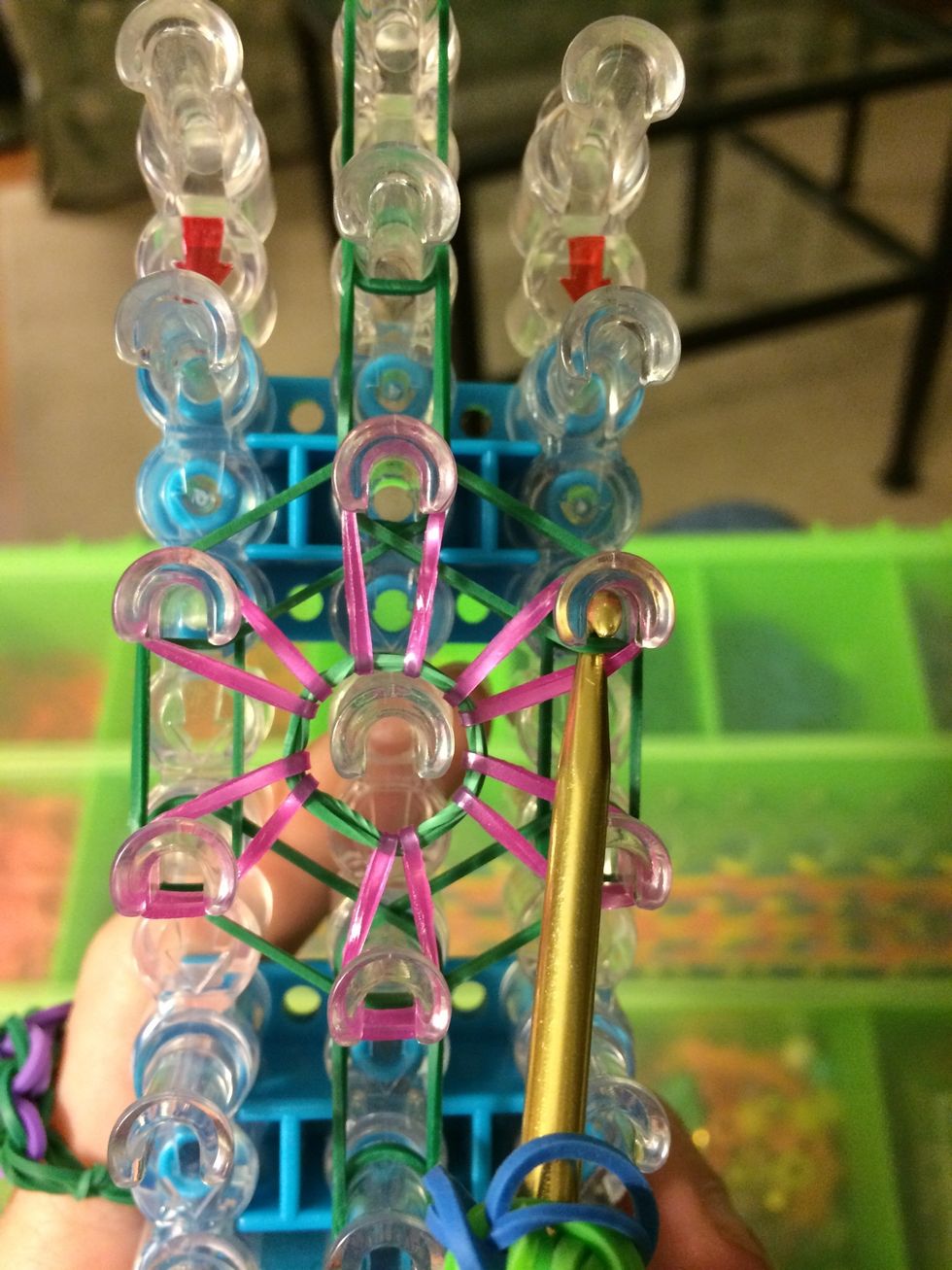 Reach in this peg and grab the 1st green one on top.