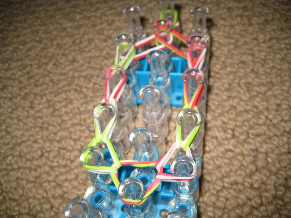 Reach to the bottom bands and bring forward. Continue until end.