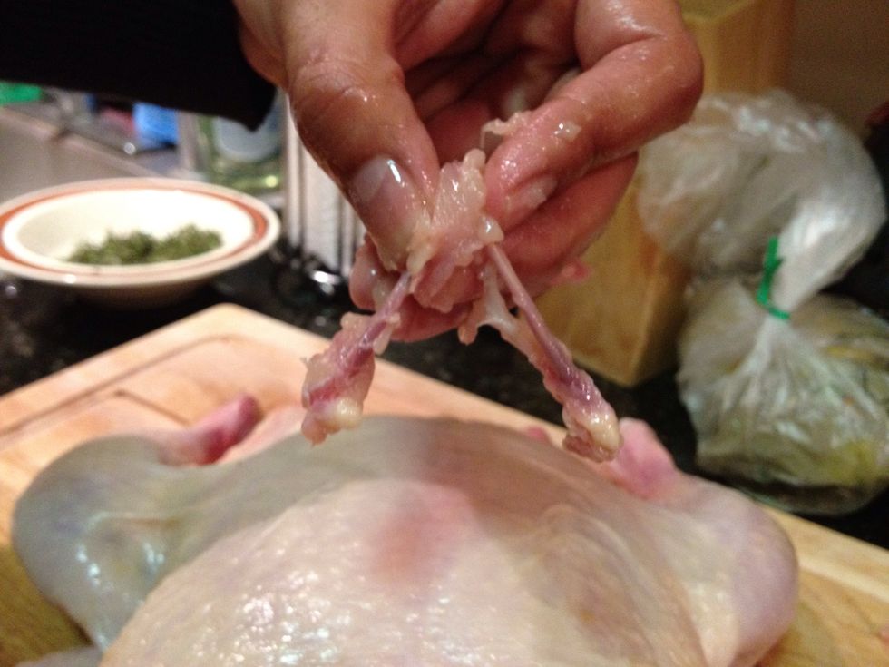 Reach up to the top of the wishbone and pull it out.