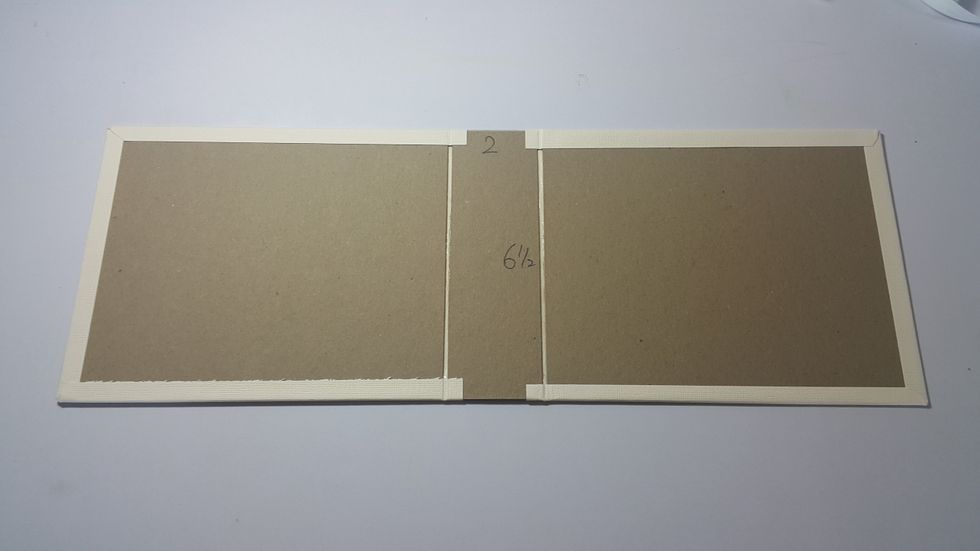 Ready cardstock 2pcs 7-1/2"x9", left 1/4" between chipboard and connect them as shown, fold excess and adhere.