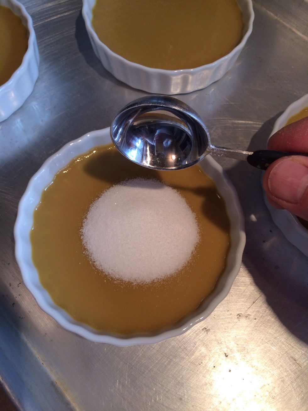 Ready for the burn! Remove from fridge and add 1 tbls of sugar to each custard.