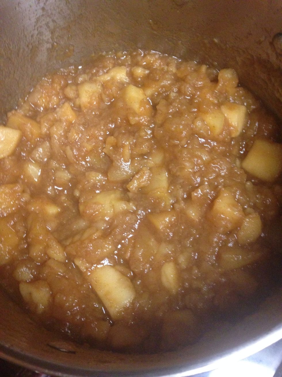 Ready to be squished. How long it takes depends on how many apples, your burner, ect. They're ready when they're almost fully broken down and easily squish under pressure.