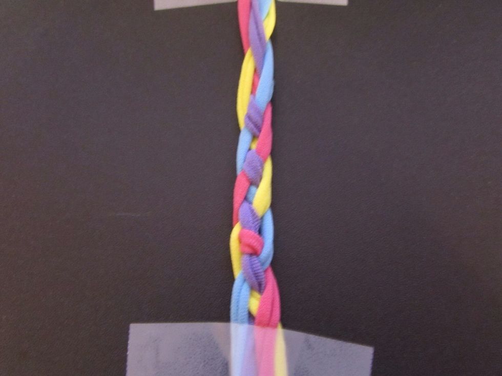 Reapeat these steps until it looks like this. The hair will have the same look as the colorful strands. When braiding this, it is just like weaving. When you get to the sides or ends, you just switch.