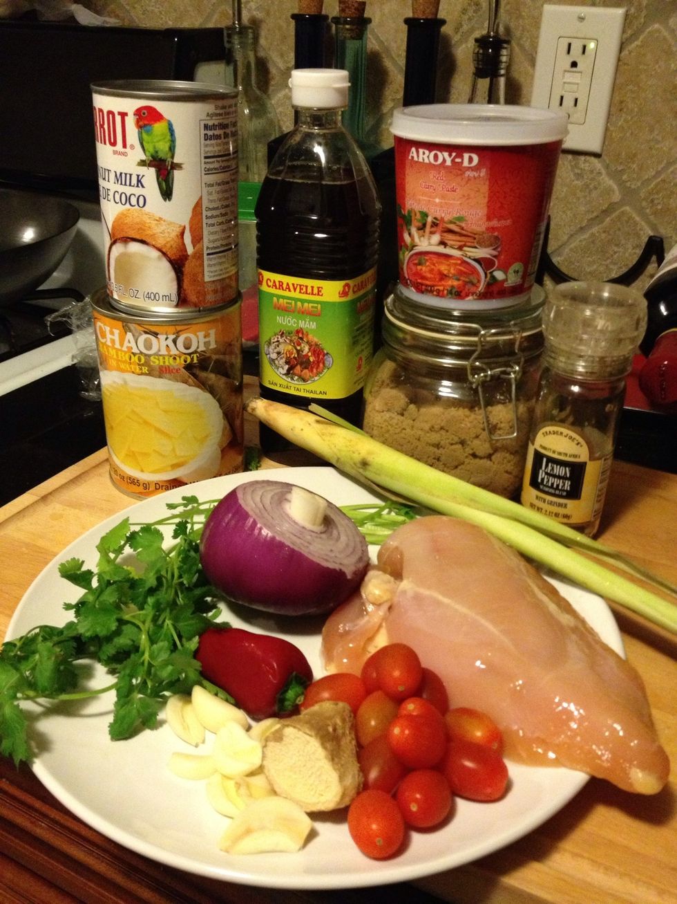 Red curry paste, coconut milk, boneless chicken breast, tomato, bamboo shoot, garlic, shallots, ginger(or galangal), lemongrass,  cilantro, fish sauce, brown sugar.