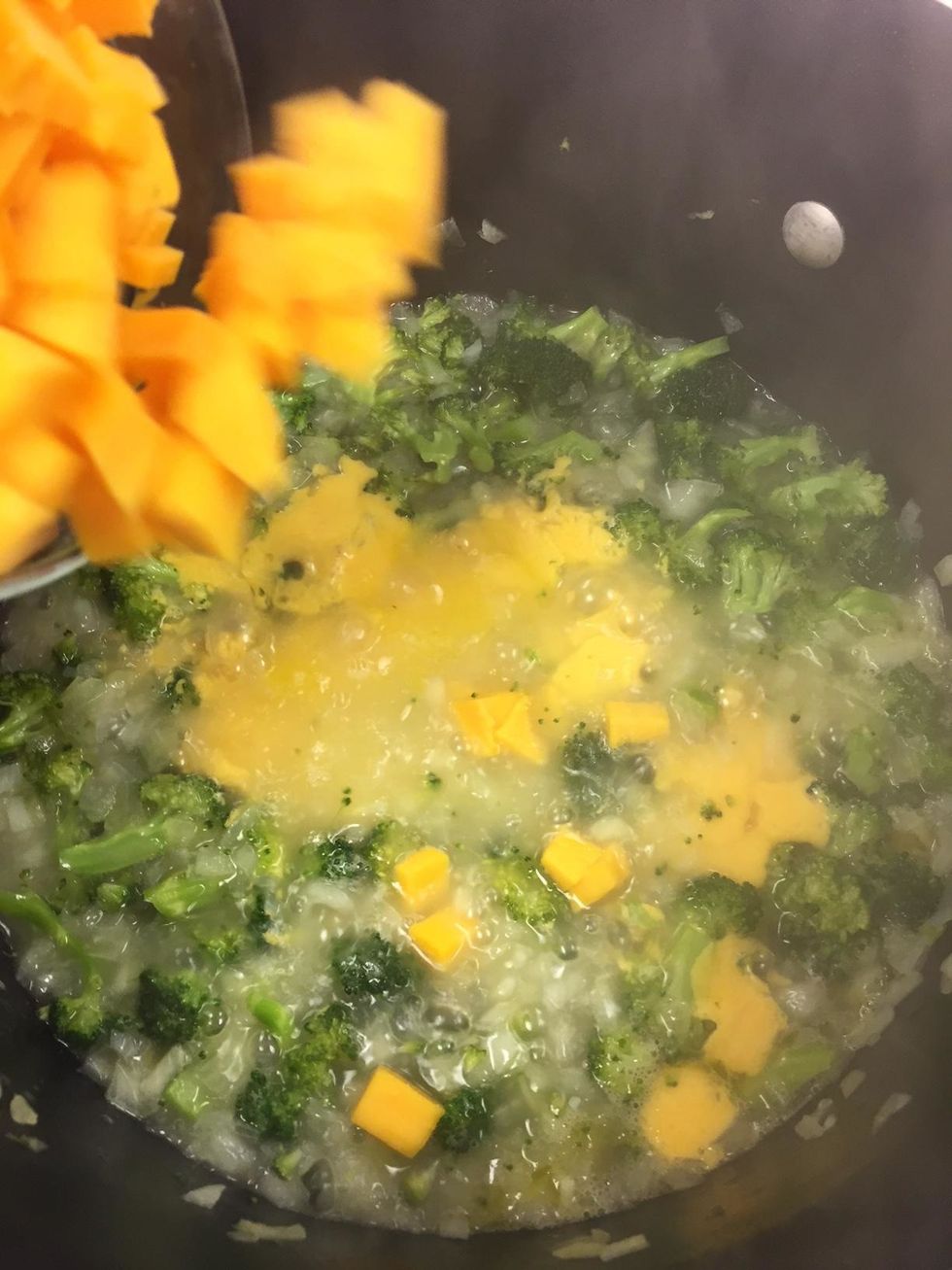 Reduce heat, and Stir in cheese cubes