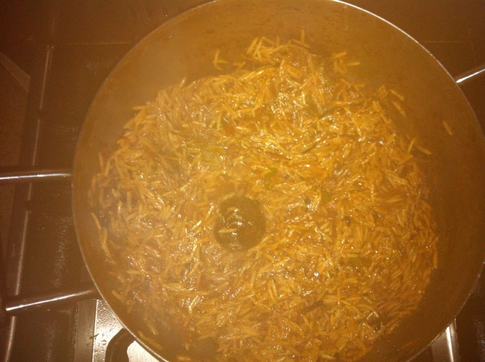 Reduce heat once the rice absorbs the water