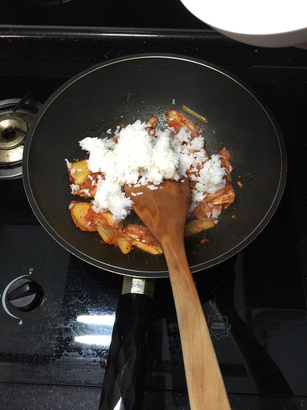 Reduce heat to low. Add 1 cup of cooked rice and mix thoroughly.