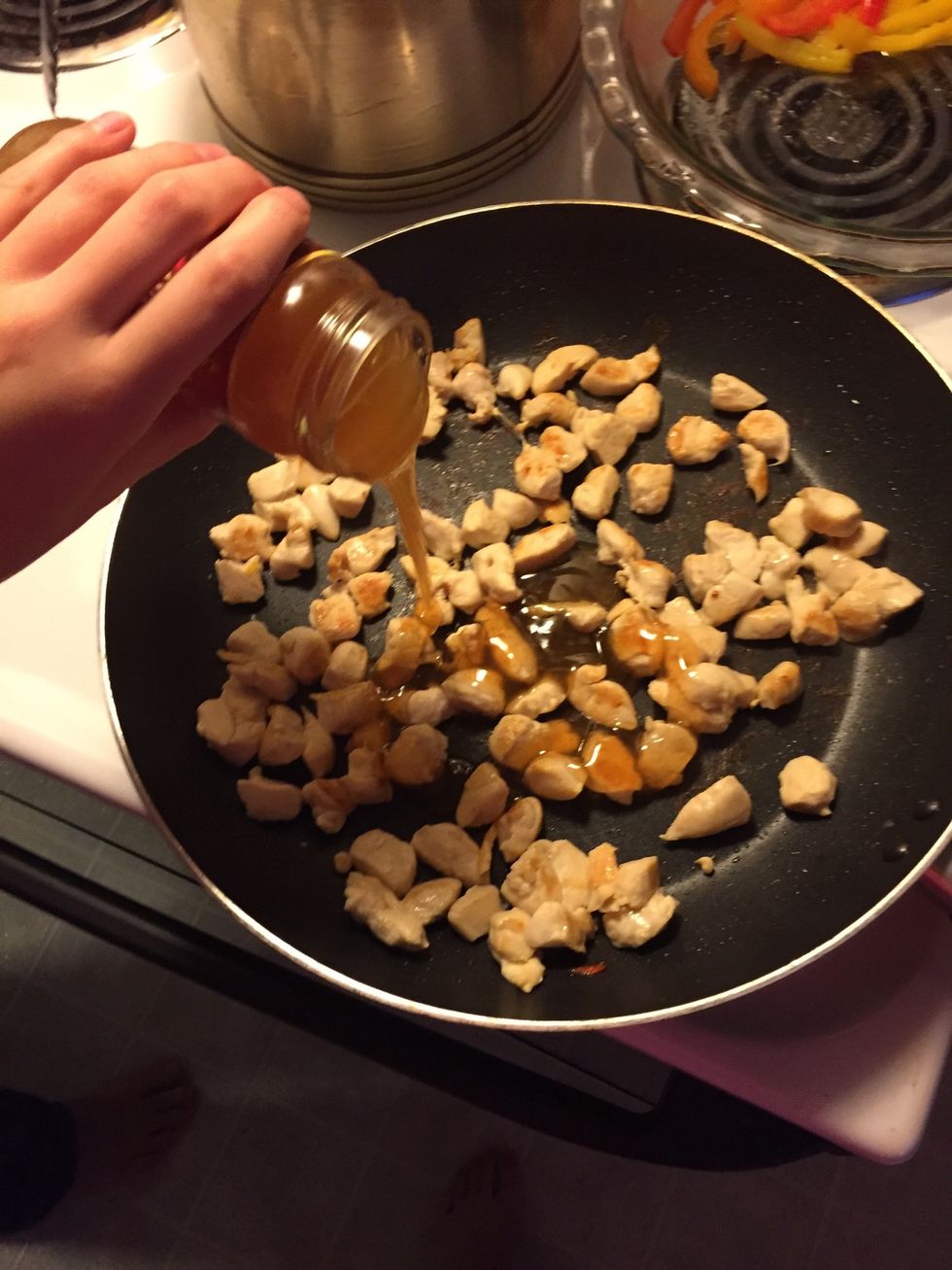 Reduce heat to low and add your sweet and sour sauce. Then raise to medium heat, stir, and set for 3 minutes