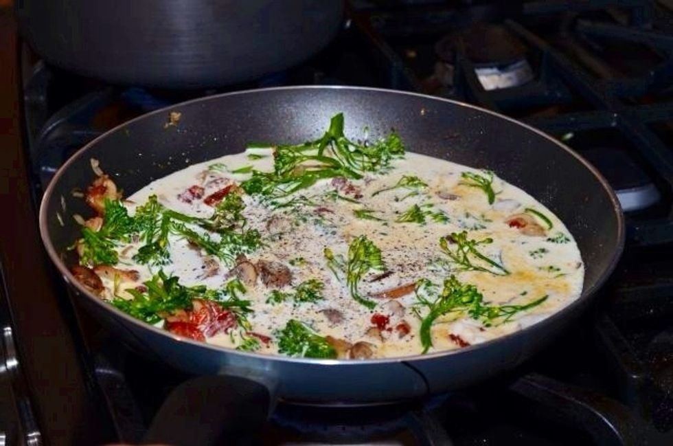 Reduce heat to medium low. Add heavy cream, about two turns in the pan (or 3/4 of a pint). Season with salt and pepper. Let the cream simmer and bubble a few minutes.