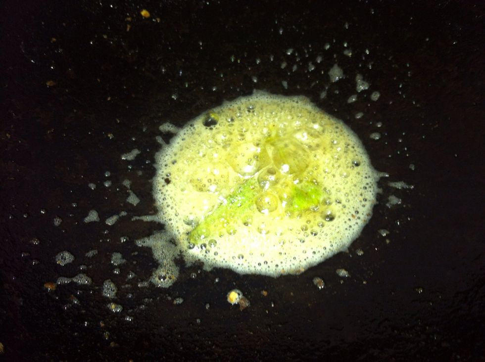 Reduce the flame. Add the lemon juice to introduce a fresh sour flavor.