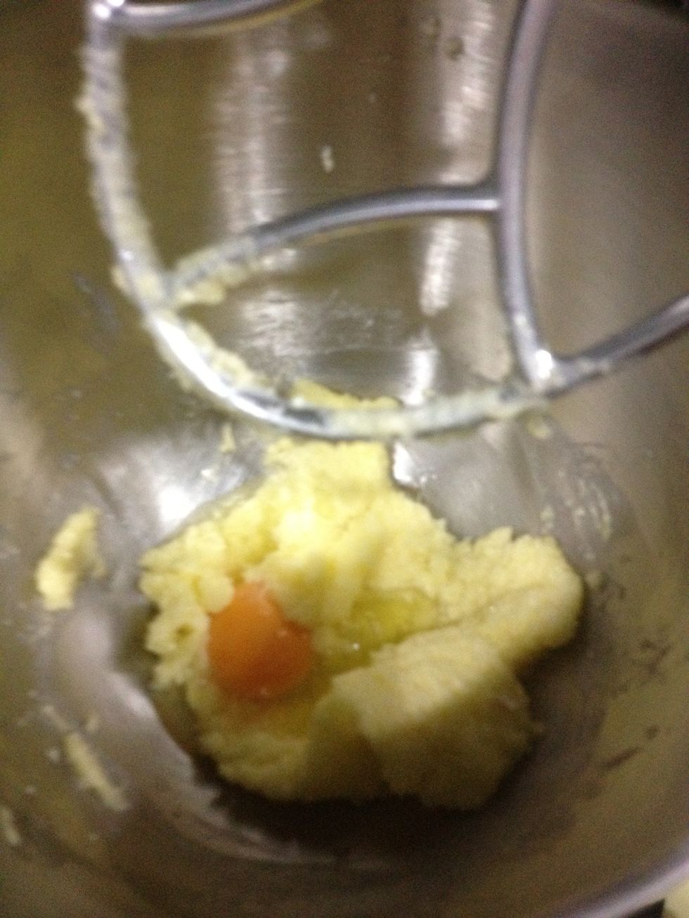 Reduce the speed to low and add eggs one at a time.