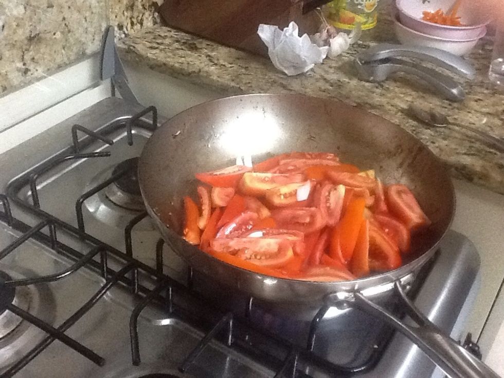 Reduce tomatoes and pepper strips.