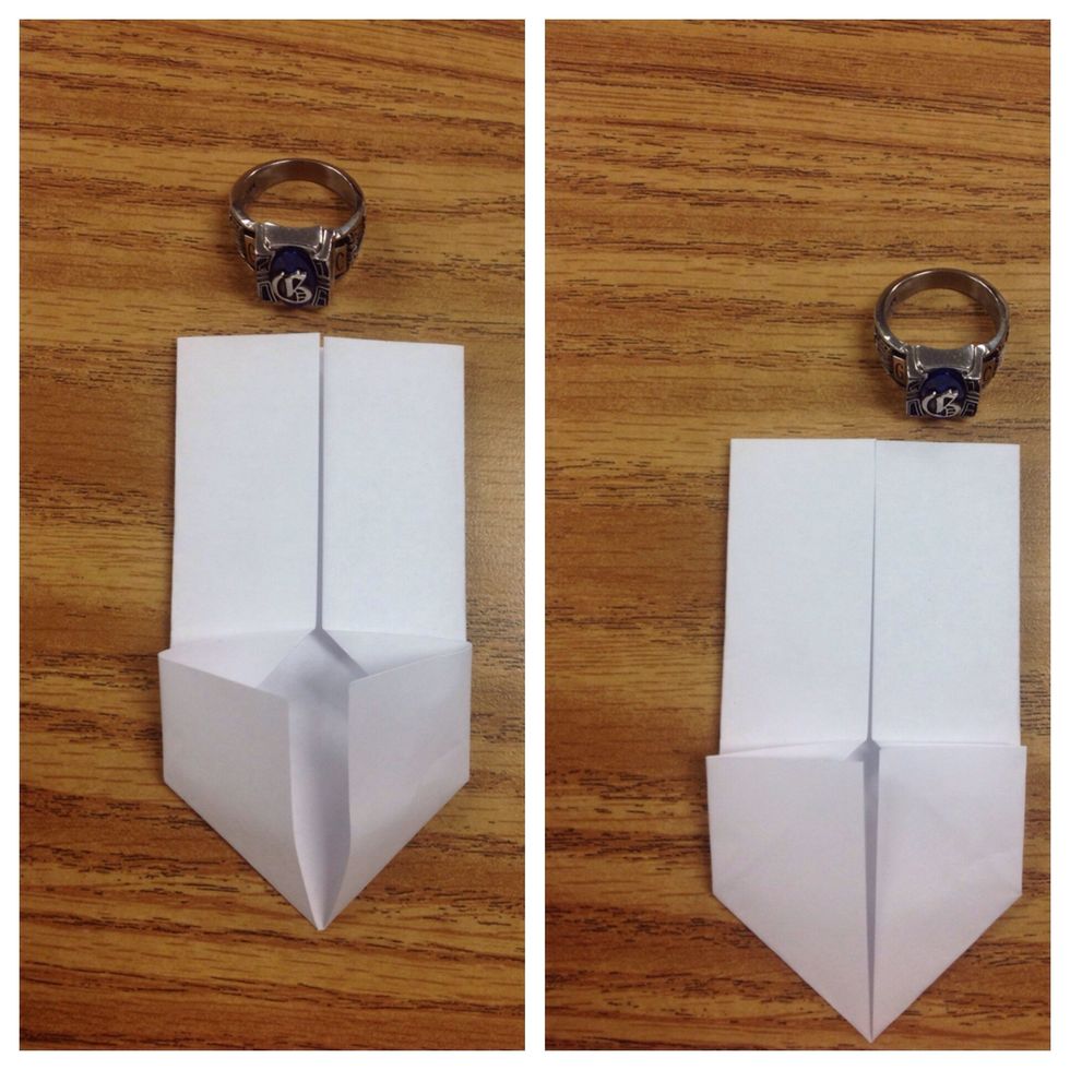 Refold the paper using the existing diagonal creases and press paper flat.