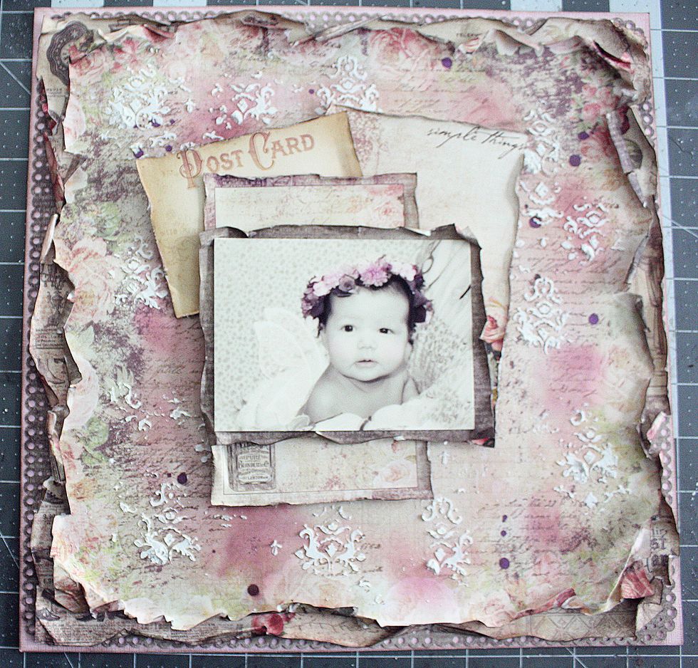 Remember how we cut the center out of the darker paper. I used it for a photo mat for contrast and make the photo pop. Most paper collections come with cards or frames. Cut those out to layer.