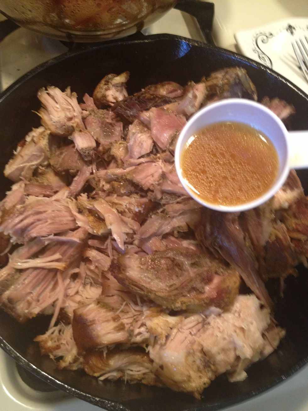 Remember the pork juice leftover in the slow cooker?. Add about 3/4 cup back Into the pork. This will make it flavorful.
