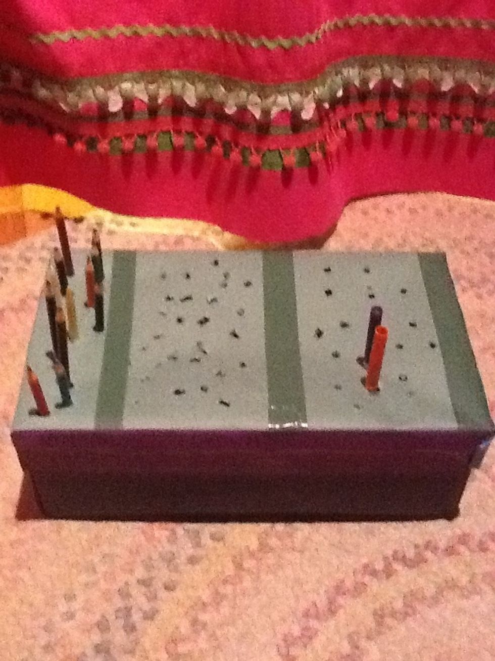 Remember those holes you made,put your supplies in the holes!