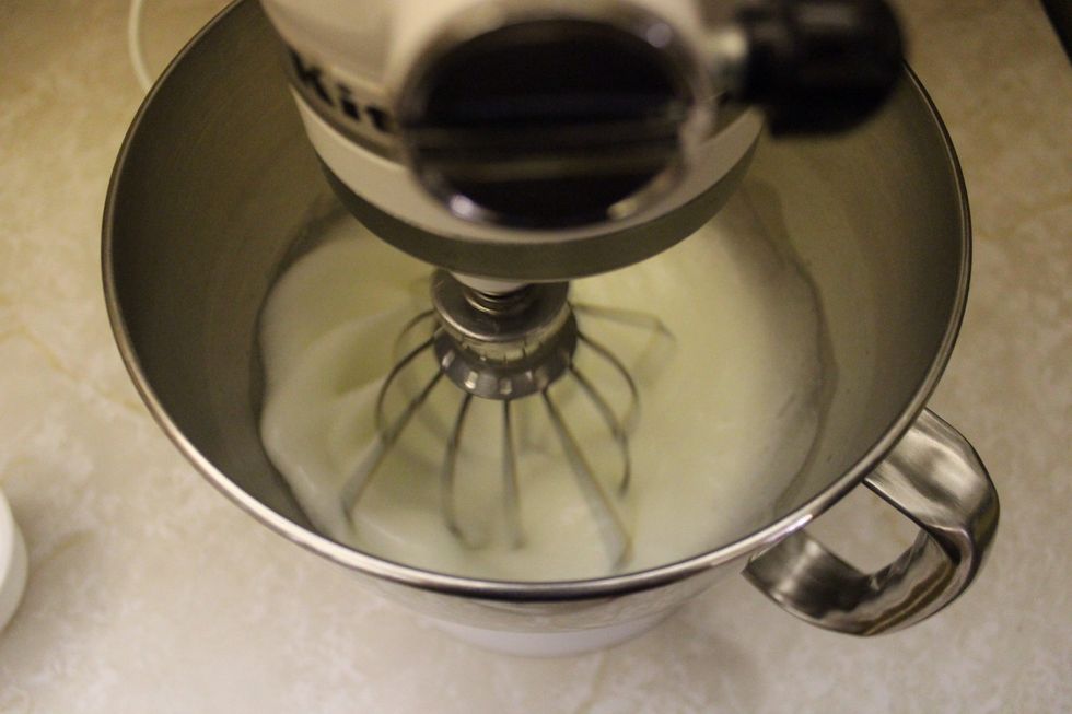 Remember to scrape the bowl frequently. While the meringue is whipping up, proceed to the next step.