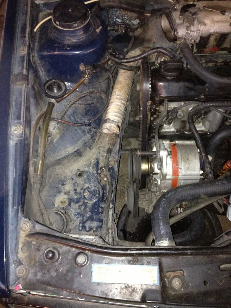 Remove air cleaner, vacuum lines and idle air stabilizer as a whole unit.