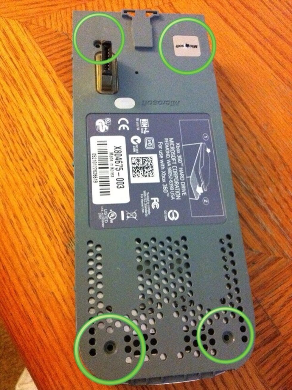 Remove all 4 star screws from the rear of the hard drive (one is under the microsoft sticker, which when broken offically voids your warranty. I am not responsible if you void your warranty.