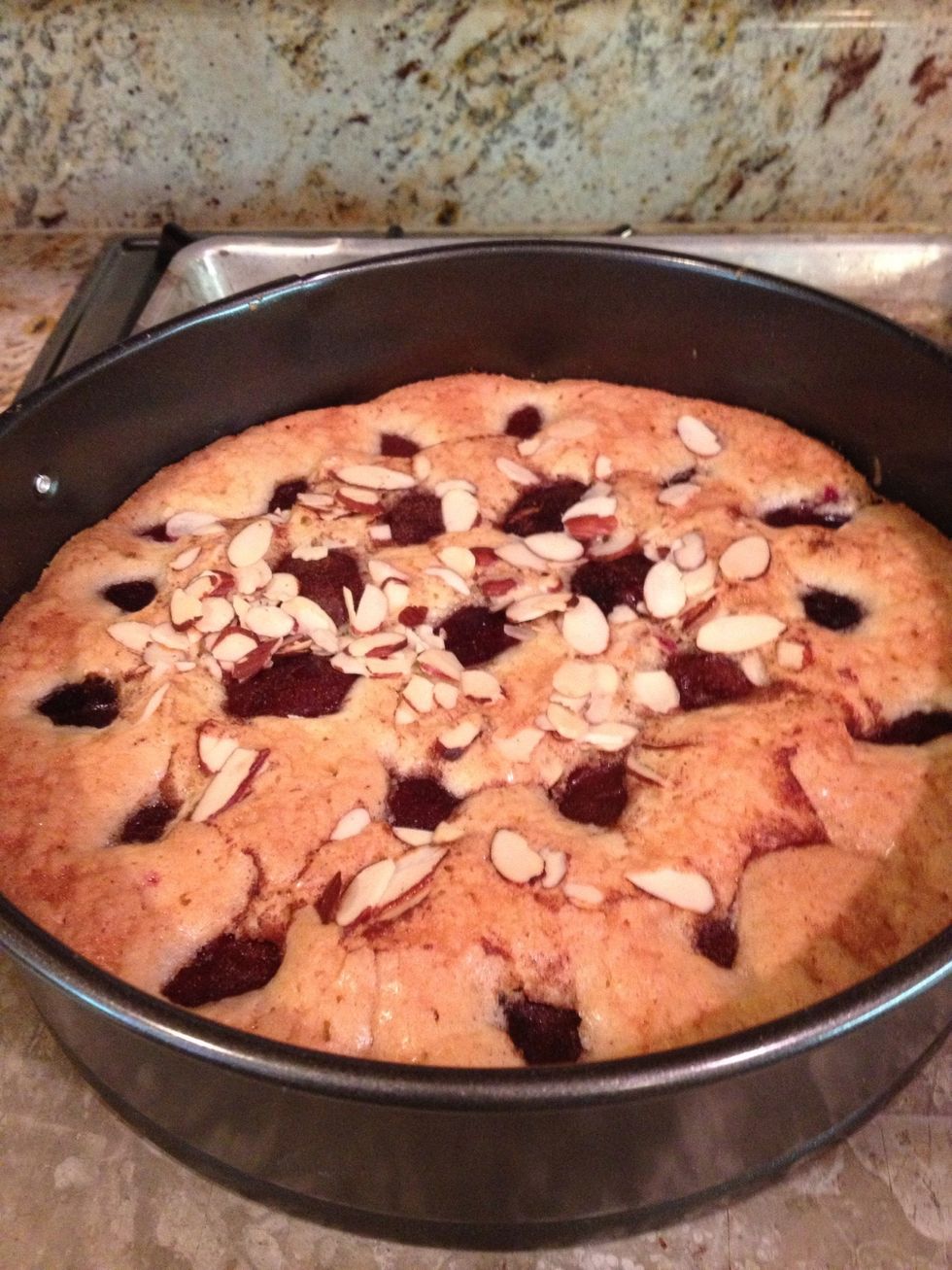 Remove and cool. Release the springform. Place a plate over the top. Flip cake over onto plate. Peel off the parchment. Place a serving platter over the cake and flip right side up.