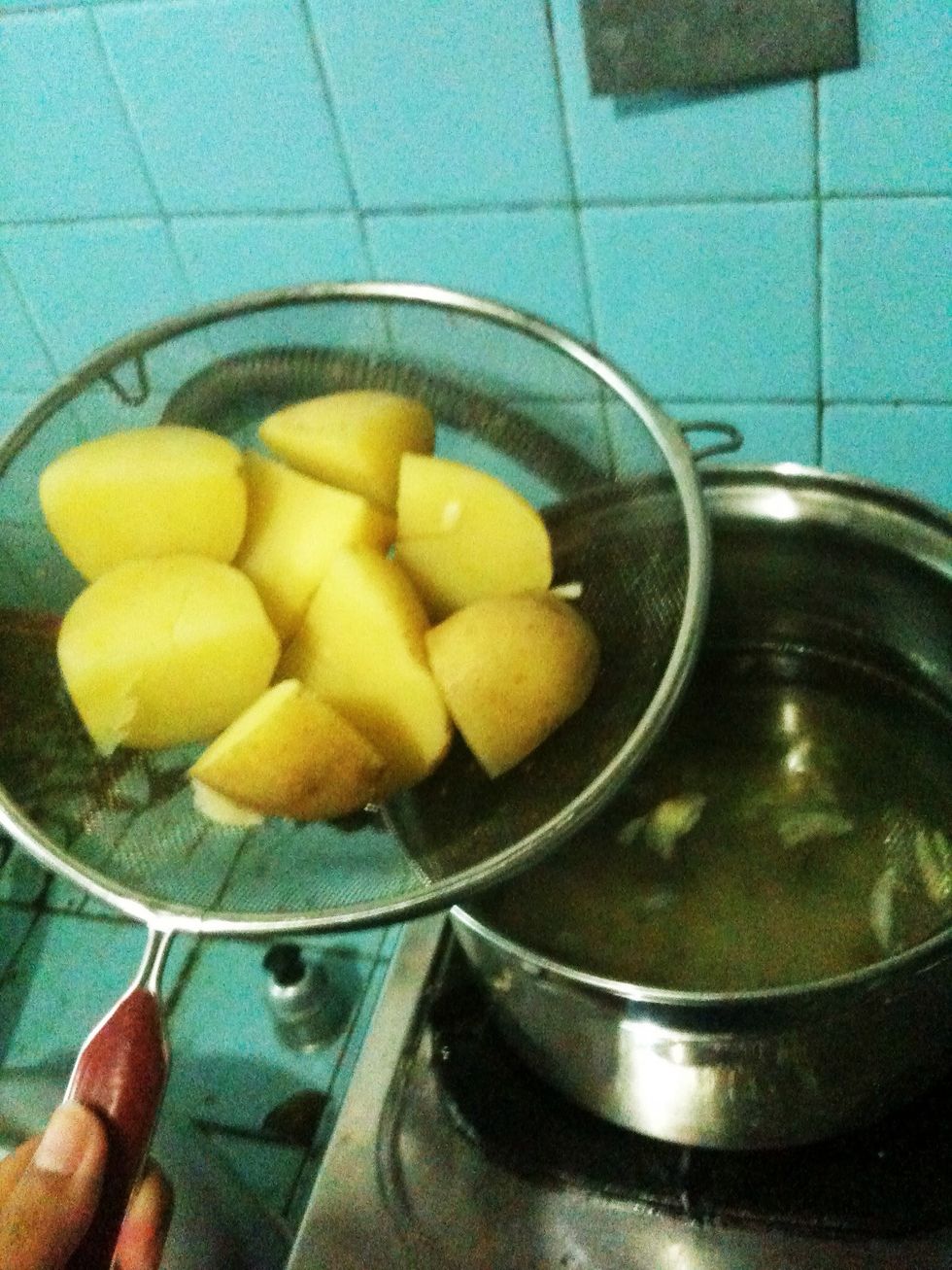 Remove and drain potatoes.