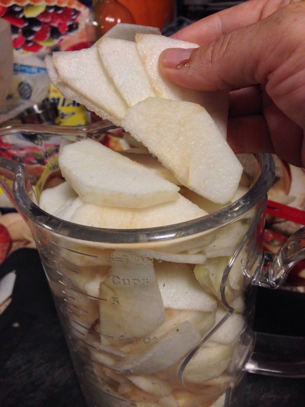 Remove any remaining skin with a knife and thinly slice the apples pieces (see photo) and set aside in a medium sized container.