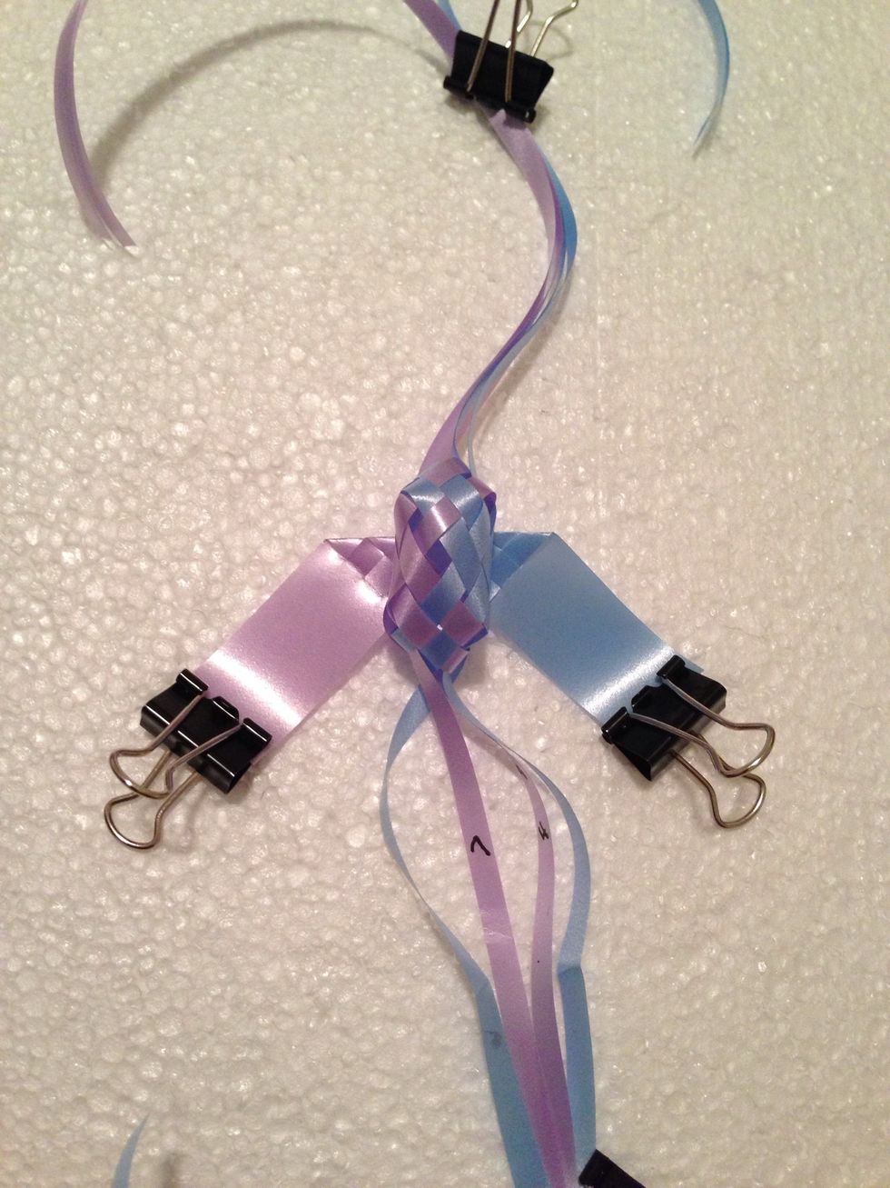 Remove any tape & pull excess lengths gently to form the body.