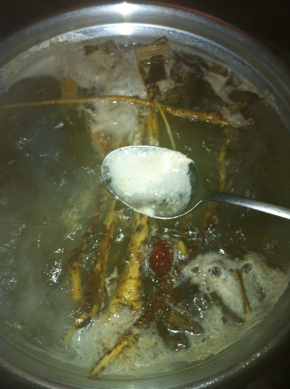 Remove as much as possible of the chicken fat that rises to the top while boiling.