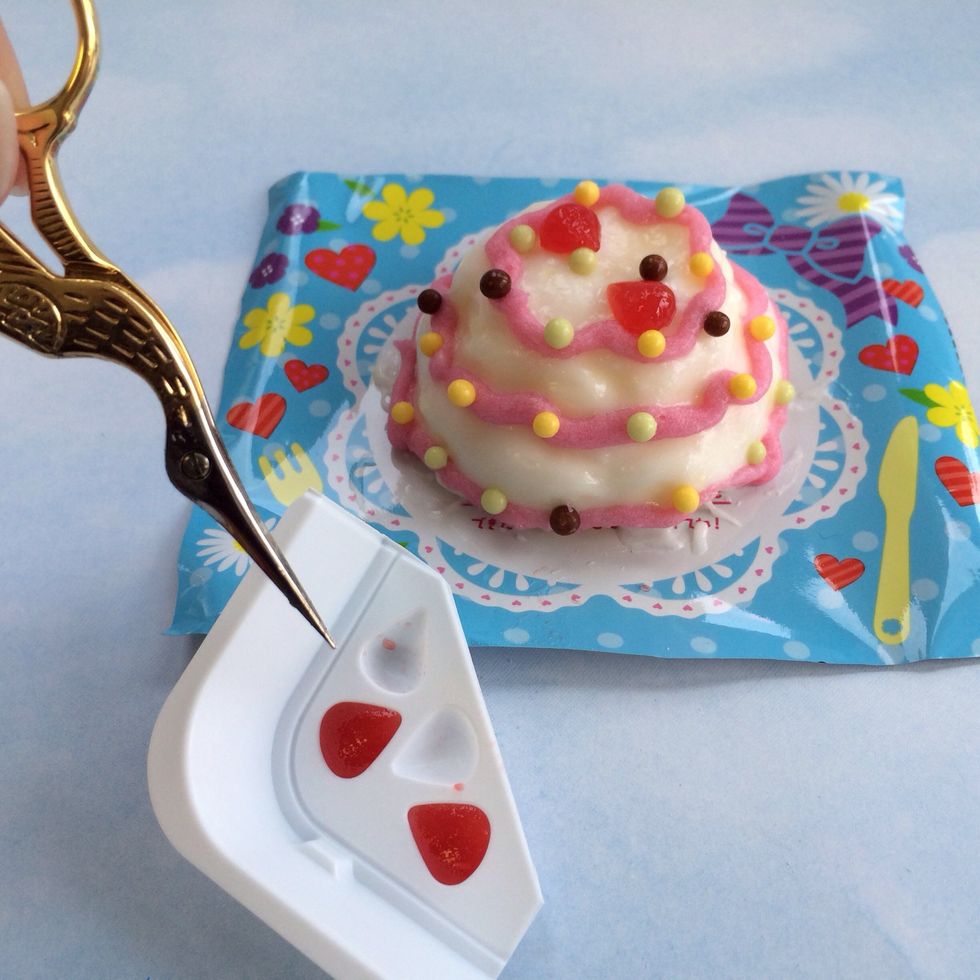 Remove Berries from Mold--You may need a knife to loosen them----Place berries on cake top