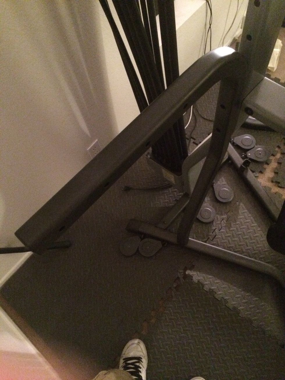 Remove both lateral arms. Two large bolts towards the top, and 2 smaller bolts on each leg.