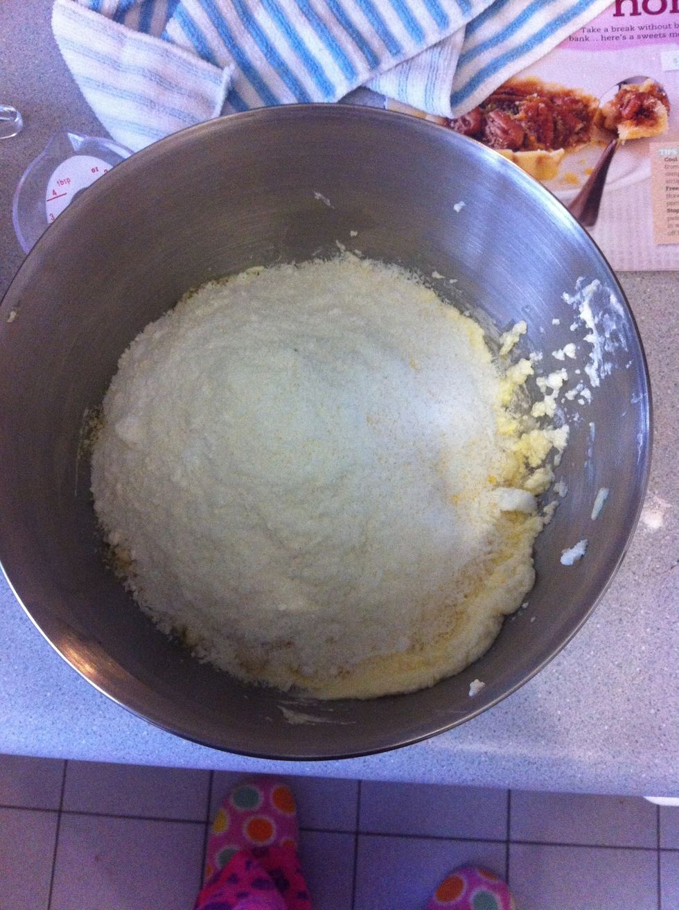 Remove bowl from mixer and add polenta, almond meal, coconut, flour and baking powder.