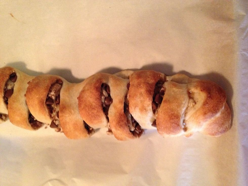 Remove bread from oven and drizzle chocolate over bread.