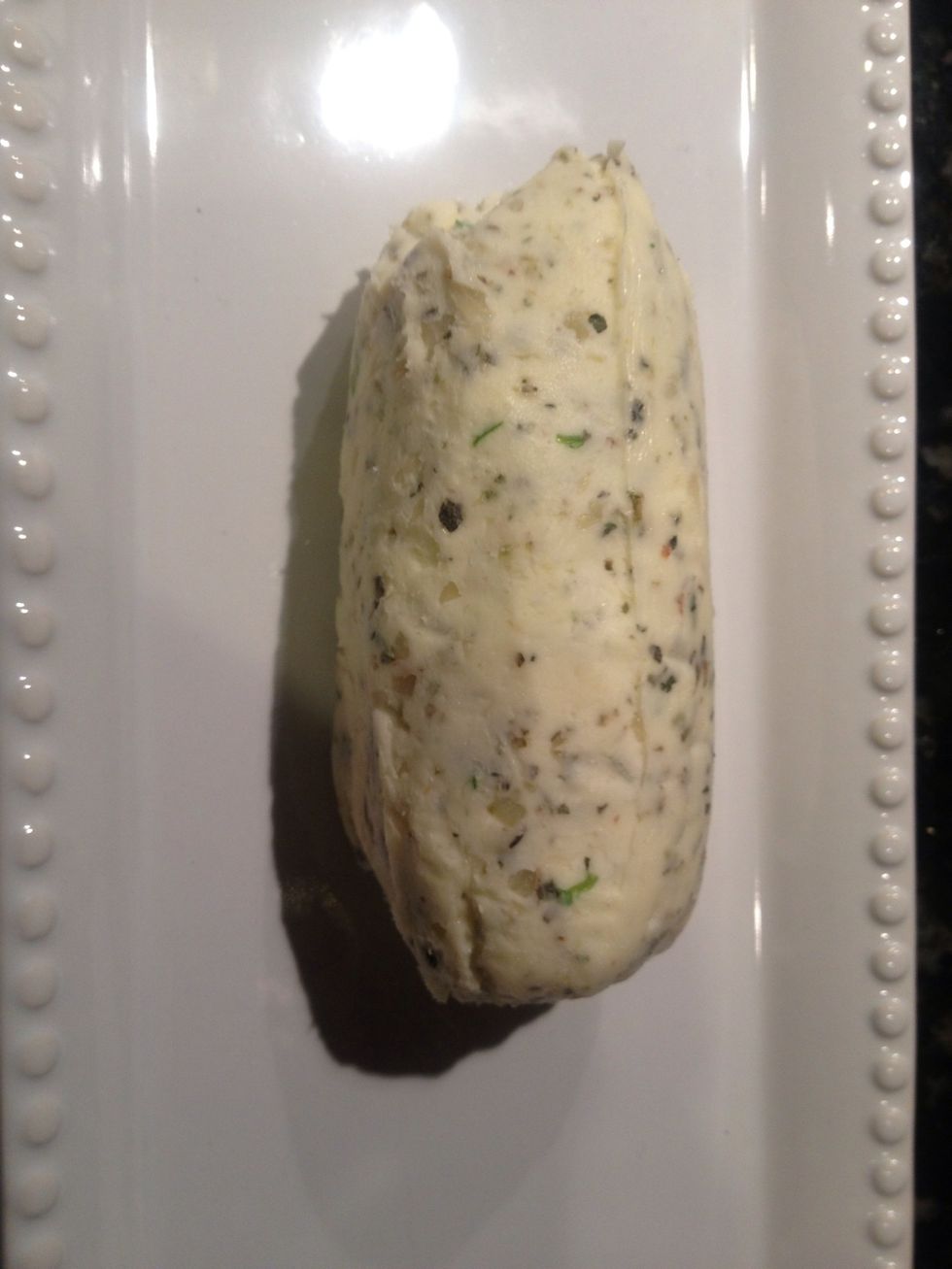 Remove butter from fridge, slice into pats to dress steaks.