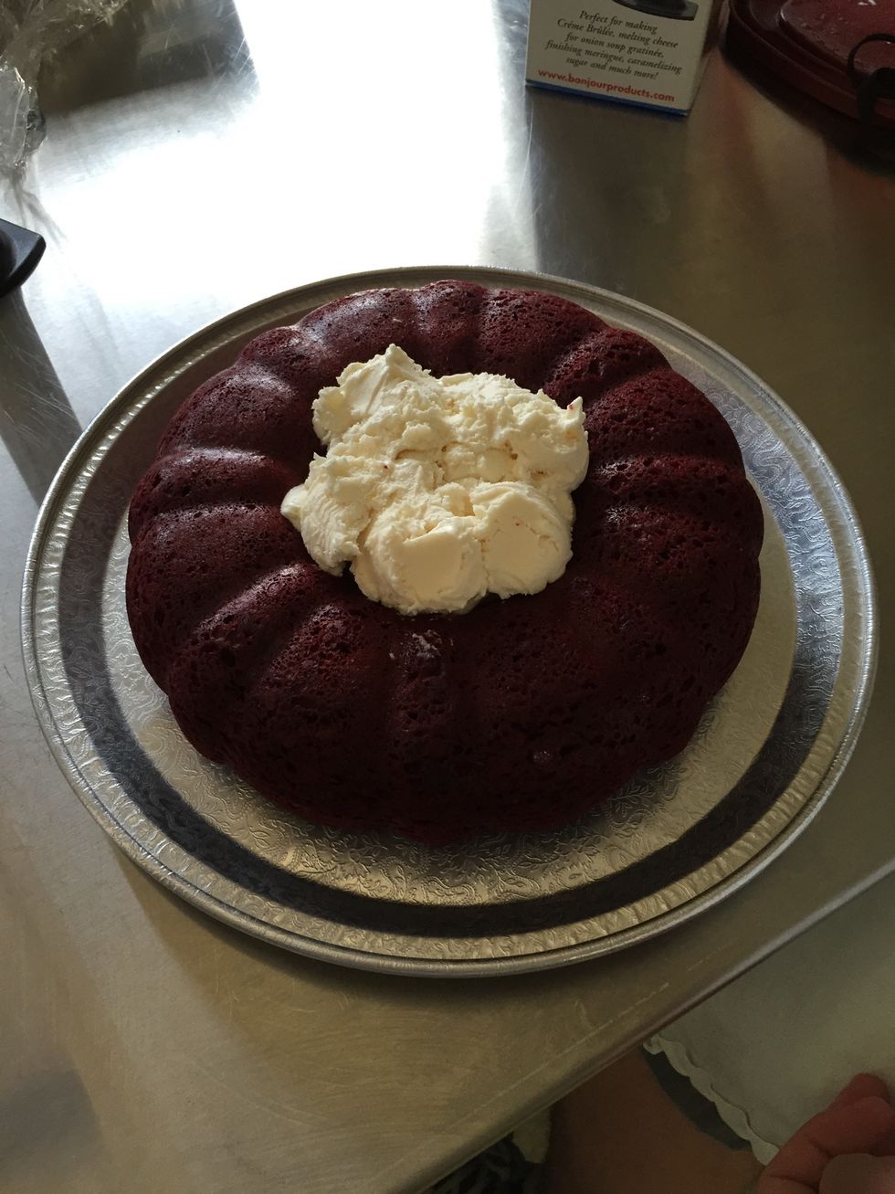 Remove cake from pan once it is completely cool, and set it on a serving platter. Fill the center of the cake with the ice cream. Make sure to pack it down so there are no holes.
