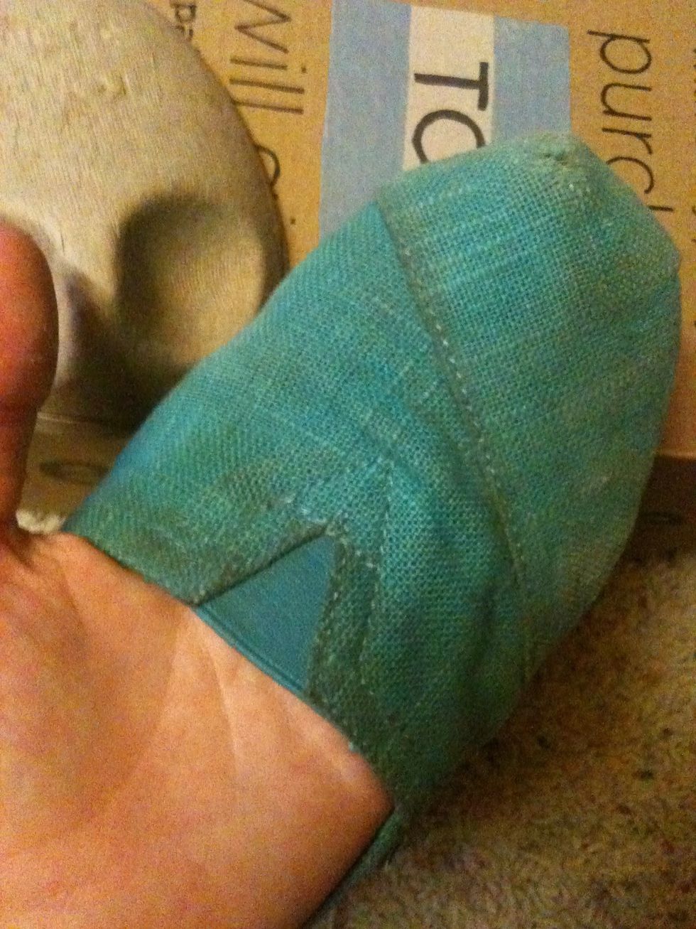 Remove cardboard and adjust the fabric as needed, making sure the edges are securely pressed down.