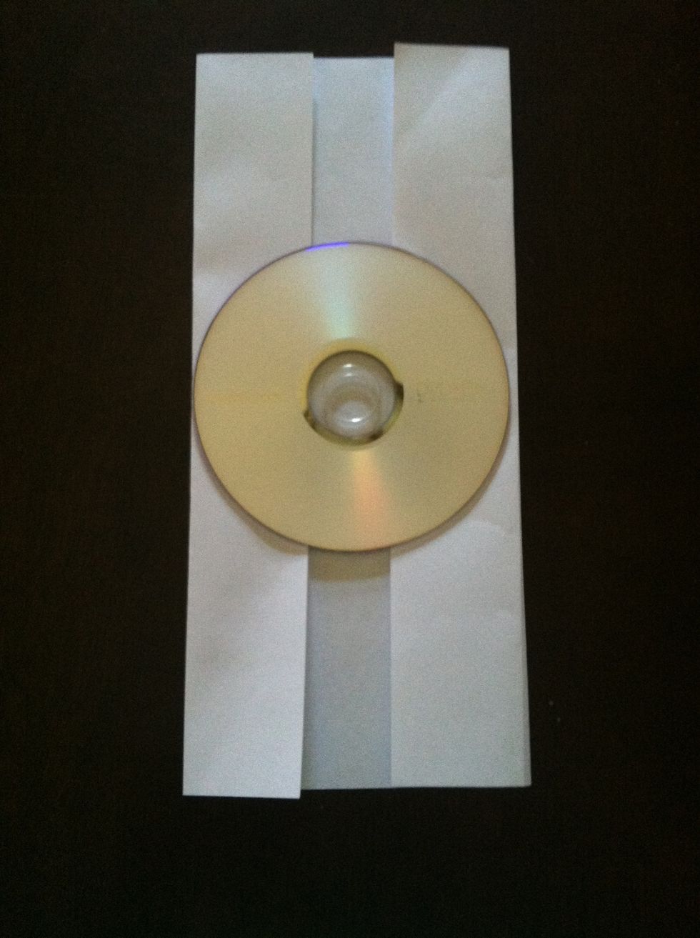 Remove cd and place in the center, on top of the folds