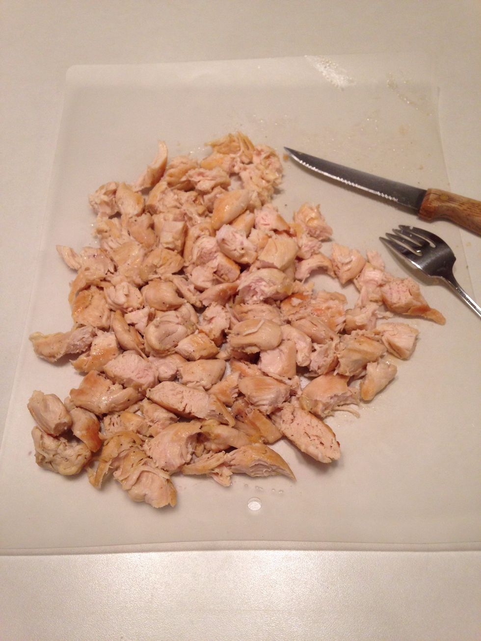 Remove chicken from pan and cut into bite sized pieces.