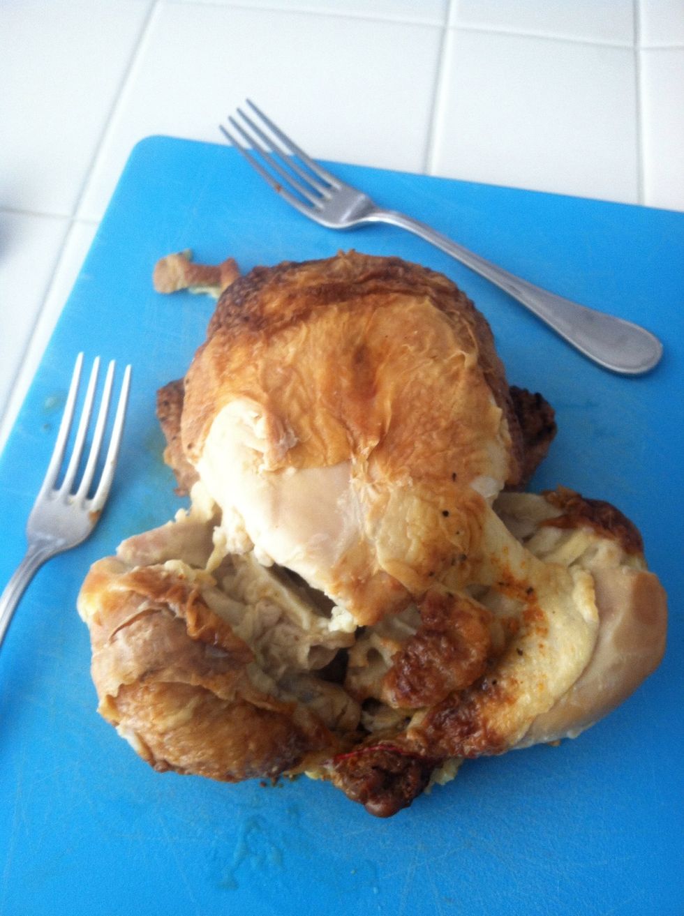 Remove chicken from pot and peel away skin and begin to shred all meat white and dark off bone.
