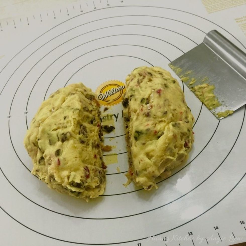 Remove dough from mixing bowl onto a pastry mat and divide the dough in half.