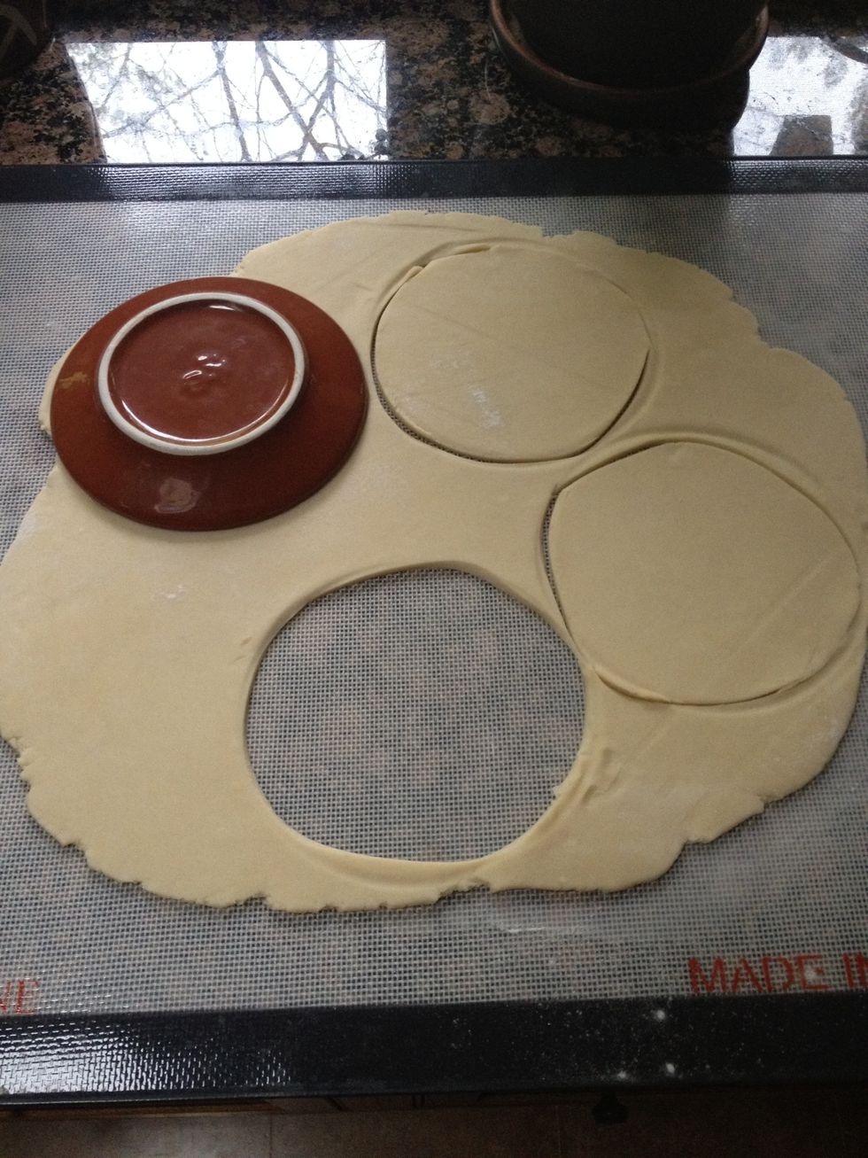 Remove dough from refrigerator and roll into 1/8 thickness. Cut into the correct size to fit any tart dish that you may have. Leave enough dough to cut slices to weave onto the top of the apples.