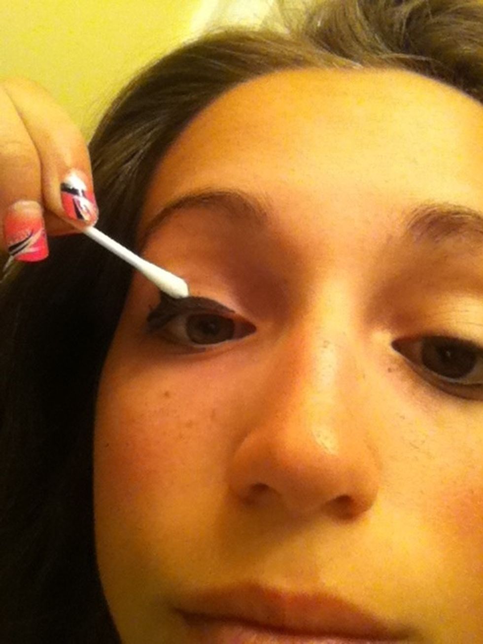Remove excess eyeliner. Make sure you move your q-tip in a straight line, or however you prefer your eyeliner to be. It works as an eraser!